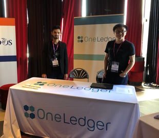 OneLedger team at the booth